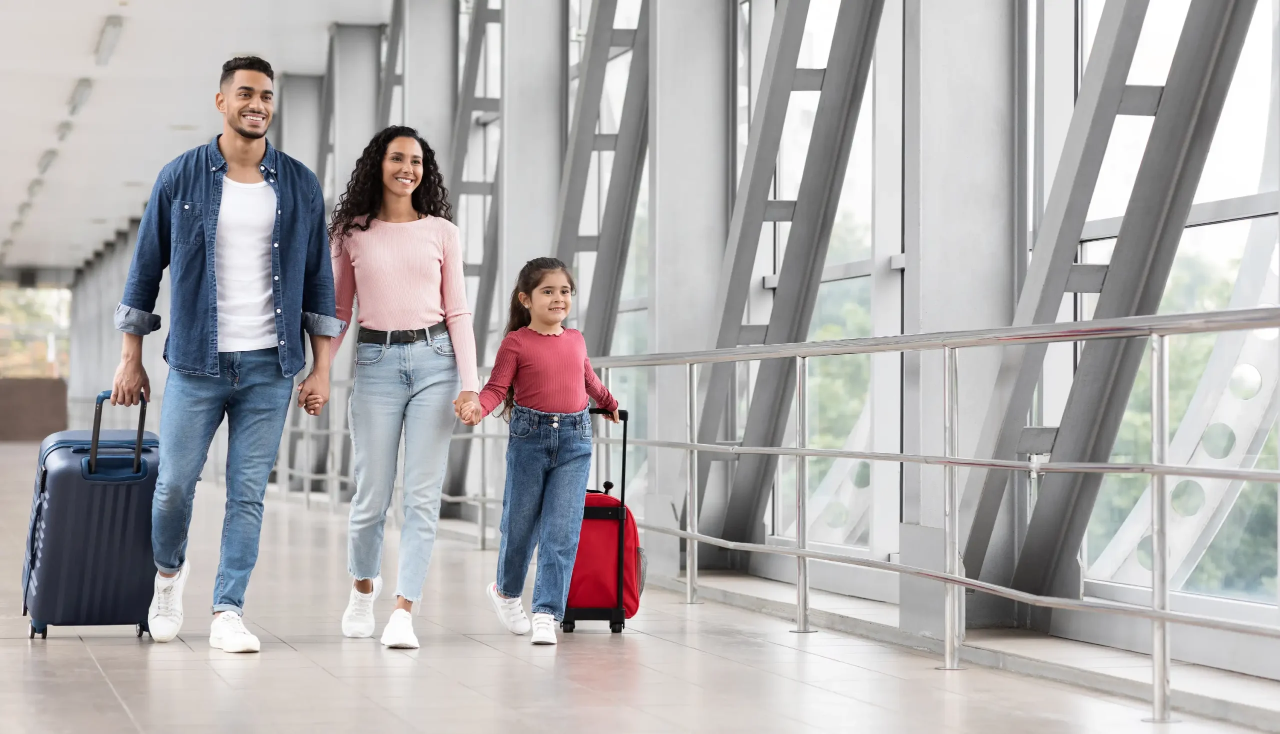 Family walking through airport
