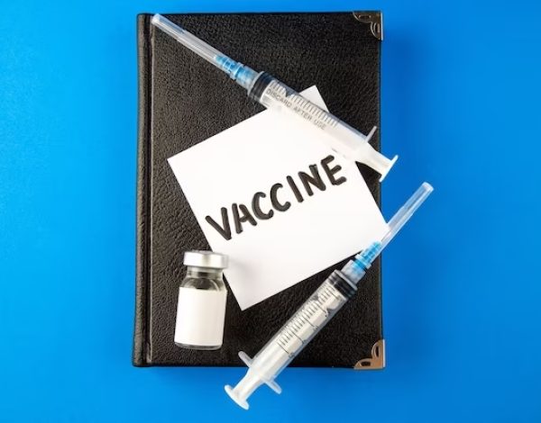 top-view-antivirus-injections-with-copybook-vaccine-blue-surface-virus-medicine-hospital-drug-covid-